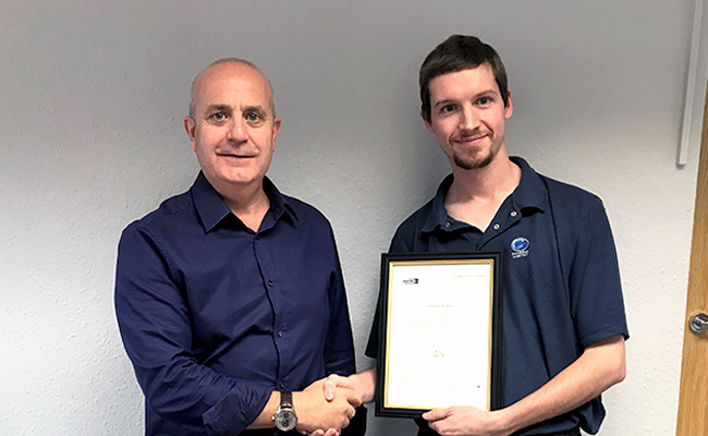 Chris Bowmen receives his Advanced Level Apprentice Award from Charpak Managing Director, Paul Smith